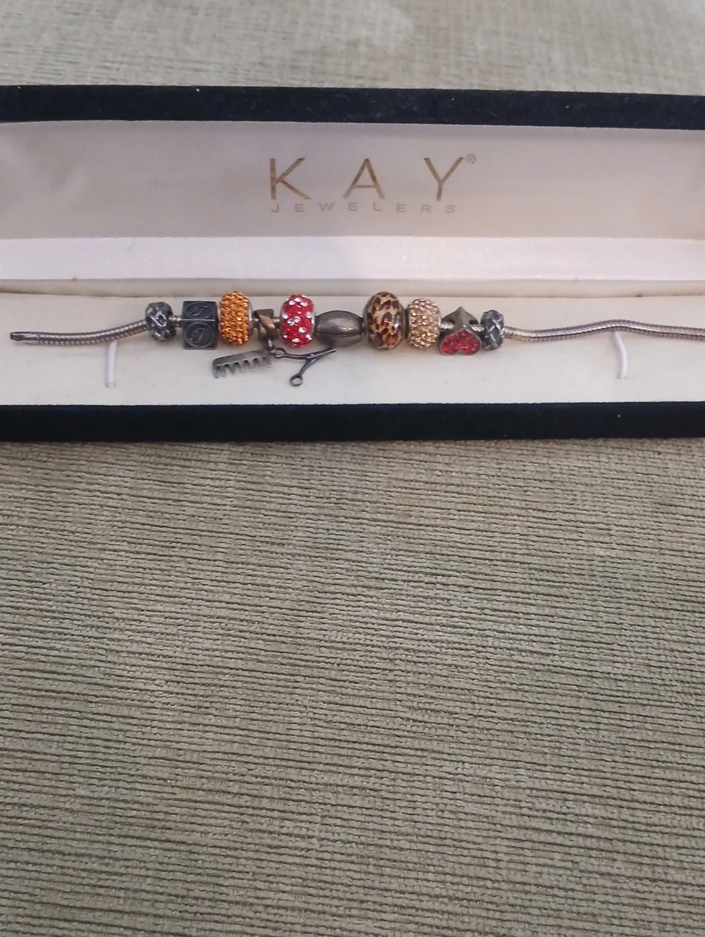 Kay Jewelers Silver Bracelet with Red and Gold Charms